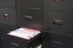 Open filing cabinet exposing files.