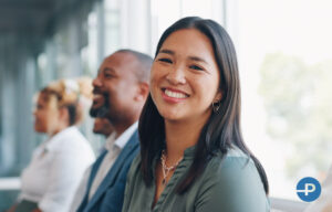 Young job candidate smiling in the company of others