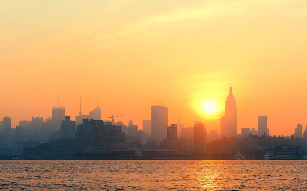 New York City cityscape at sunrise.